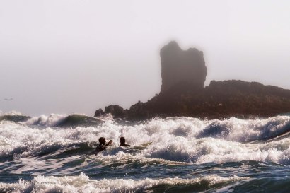 Surfers near Cannon Beach. OR
